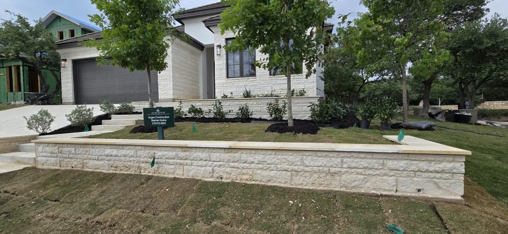 new retaining wall in new landscape installation